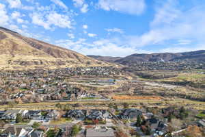 View of mountain background featuring nearby suburban area