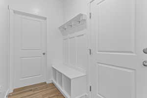 Mudroom with wood finished floors