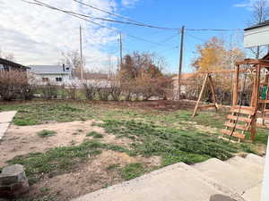 View of yard featuring a playground