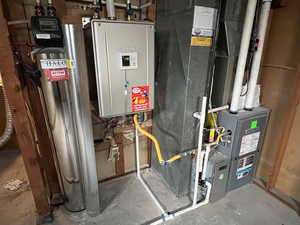 Utility room featuring heating unit