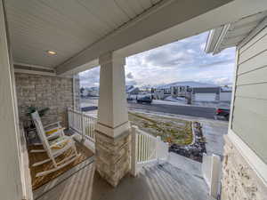 Covered porch with a residential view