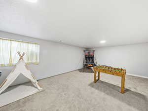 Game room featuring carpet flooring and recessed lighting