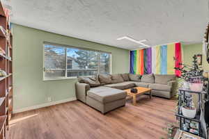 Living room featuring wood finished floors and baseboards
