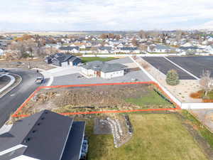 Aerial perspective of suburban area featuring property boundaries highlighted