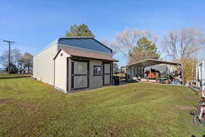 View of shed with a detached carport