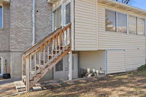 View of property exterior with brick siding
