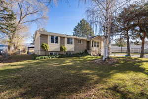 View of front of home featuring brick siding