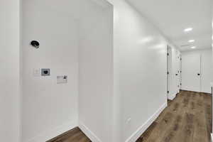 Laundry room with recessed lighting, dark wood finished floors, hookup for a washing machine, and hookup for an electric dryer