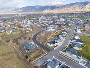Aerial overview of property's location with nearby suburban area and a mountain backdrop