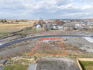 Aerial view of property and surrounding area featuring property boundaries highlighted