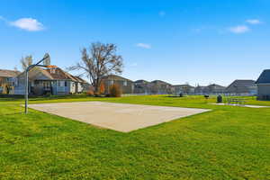 View of basketball court with a residential view and community basketball court