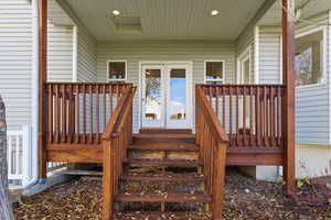 Property entrance featuring a deck