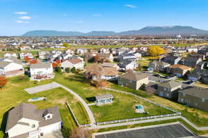 Aerial view of residential area featuring a mountain backdrop
