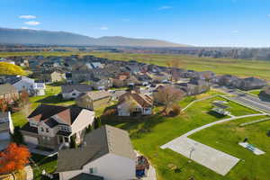 Aerial perspective of suburban area featuring a mountainous background