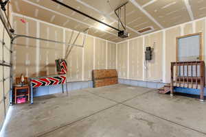 Garage featuring a garage door opener