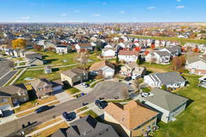 Aerial view of property's location with nearby suburban area