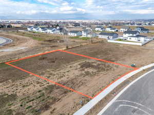 Aerial view of residential area with property boundaries highlighted