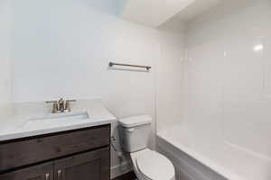 Bathroom featuring vanity and shower / bathtub combination