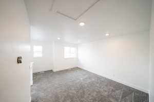 Photo of home built in past by OLO.  Unfurnished room featuring carpet and recessed lighting