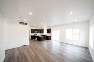 Photo of home built in past by OLO.  Unfurnished living room with recessed lighting and light wood-style floors