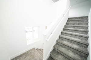 Photo of home built in past by OLO. Stairway featuring carpet floors