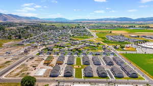 Aerial view of residential area featuring a mountainous background