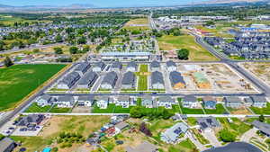 Aerial overview of property's location with nearby suburban area and a mountain backdrop