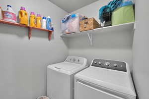 Laundry room featuring washing machine and clothes dryer