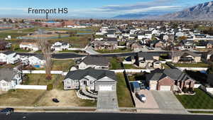 Aerial overview of property's location with nearby suburban area and a mountain backdrop