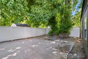 Fenced backyard featuring a patio