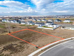 Aerial view of residential area featuring property parcel outlined