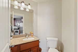Bathroom with vanity and toilet