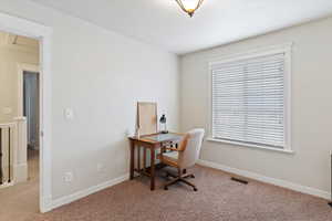 Office area featuring carpet
