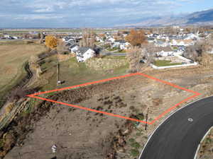 Aerial view of residential area with property parcel outlined