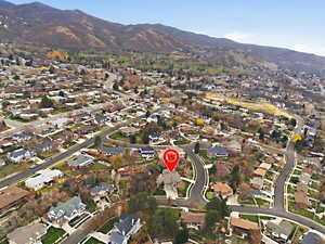 View of property location with nearby suburban area and mountains