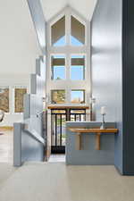 Foyer entrance with plenty of natural light and high vaulted ceiling