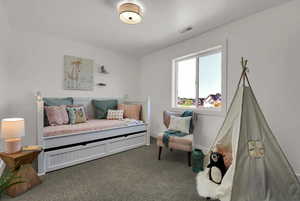 Carpeted bedroom with baseboards