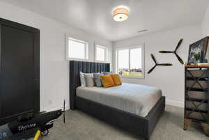 Carpeted bedroom with baseboards