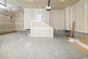 Garage featuring a garage door opener