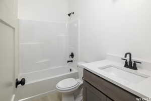 Bathroom featuring vanity and shower / bathtub combination