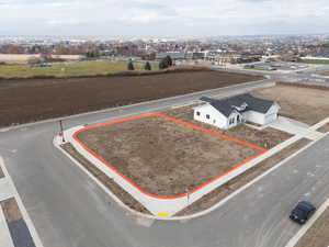 Aerial view of property and surrounding area featuring property boundaries highlighted