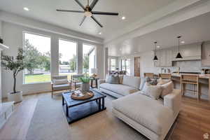 Great room featuring light wood finished floors, recessed lighting, and a ceiling fan