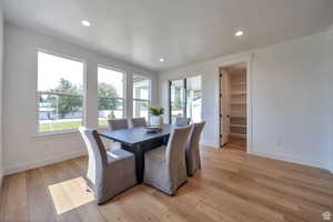 Dining area featuring light wood-style flooring and recessed lighting