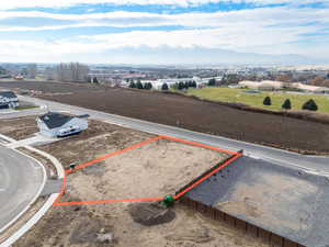 Aerial view of property and surrounding area featuring property parcel outlined