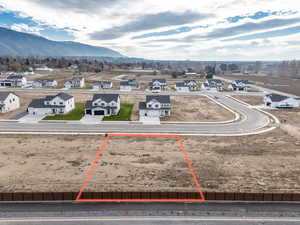 Aerial perspective of suburban area featuring a mountain backdrop