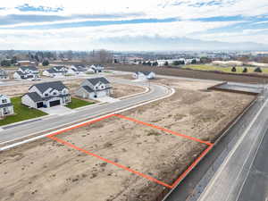 Aerial view of residential area featuring property parcel outlined