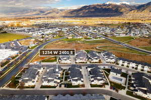 View of property location with nearby suburban area and mountains