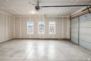 Garage featuring a garage door opener