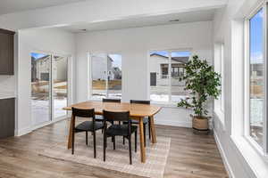Dining space with light wood finished floors and baseboards
