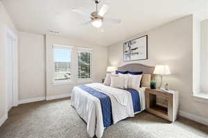 Bedroom featuring carpet floors and ceiling fan